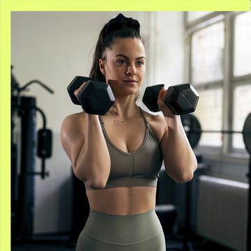 Two women engaged in fitness activities: one performing a stretch, the other lifting dumbbells. Two women engaged in fitness activities: one performing a stretch, the other lifting dumbbells.
