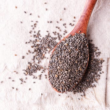 Chia seeds on wooden spoon Chia seeds on wooden spoon