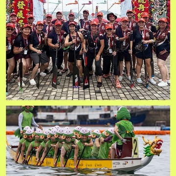 Dragon boat racing teams celebrating with costumes and paddles at a waterfront event.