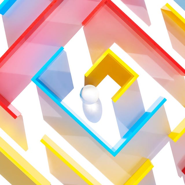 Colorful maze structure with a white ball in the center. Colorful maze structure with a white ball in the center.