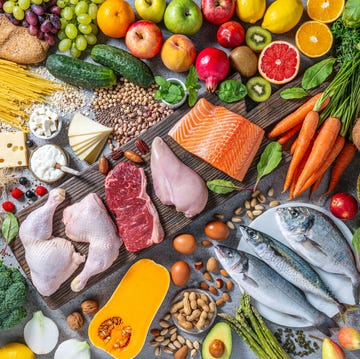 a vibrant display of mediterranean diet essentials showcasing fruits, vegetables, grains, proteins, and healthy fats