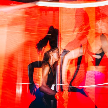 A dynamic portrayal of a woman exercising in a vibrant, abstract environment with flowing colors and energetic motion.