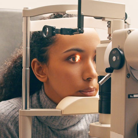 Optician, test and eye exam or care of a woman or customer for vision, eyesight and lens. Optometrist and person at machine or light for healthcare consultation for optometry or ophthalmology service optician, test and eye exam or care of a woman or customer for vision, eyesight and lens optometrist and person at machine or light for healthcare consultation for optometry or ophthalmology service