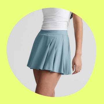 Lululemon backpack next to a woman's light blue pleated skirt, set against a vibrant background. Lululemon backpack next to a woman's light blue pleated skirt, set against a vibrant background.