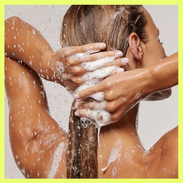 Bottle of OUAI fine hair shampoo with bubbles, alongside a person washing their hair with shampoo lather. Bottle of OUAI fine hair shampoo with bubbles, alongside a person washing their hair with shampoo lather.