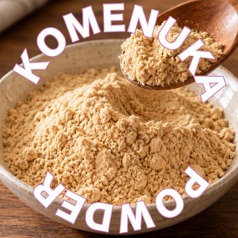 bowl of komenuka powder with wooden spoon and text overlay.