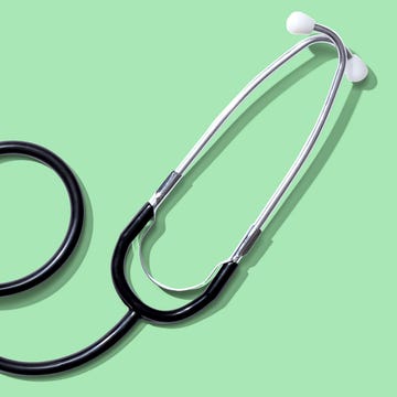 Stethoscope on a green background.