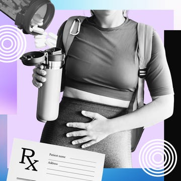 Person holding a water bottle while resting a hand on their abdomen, with a prescription form in the foreground.