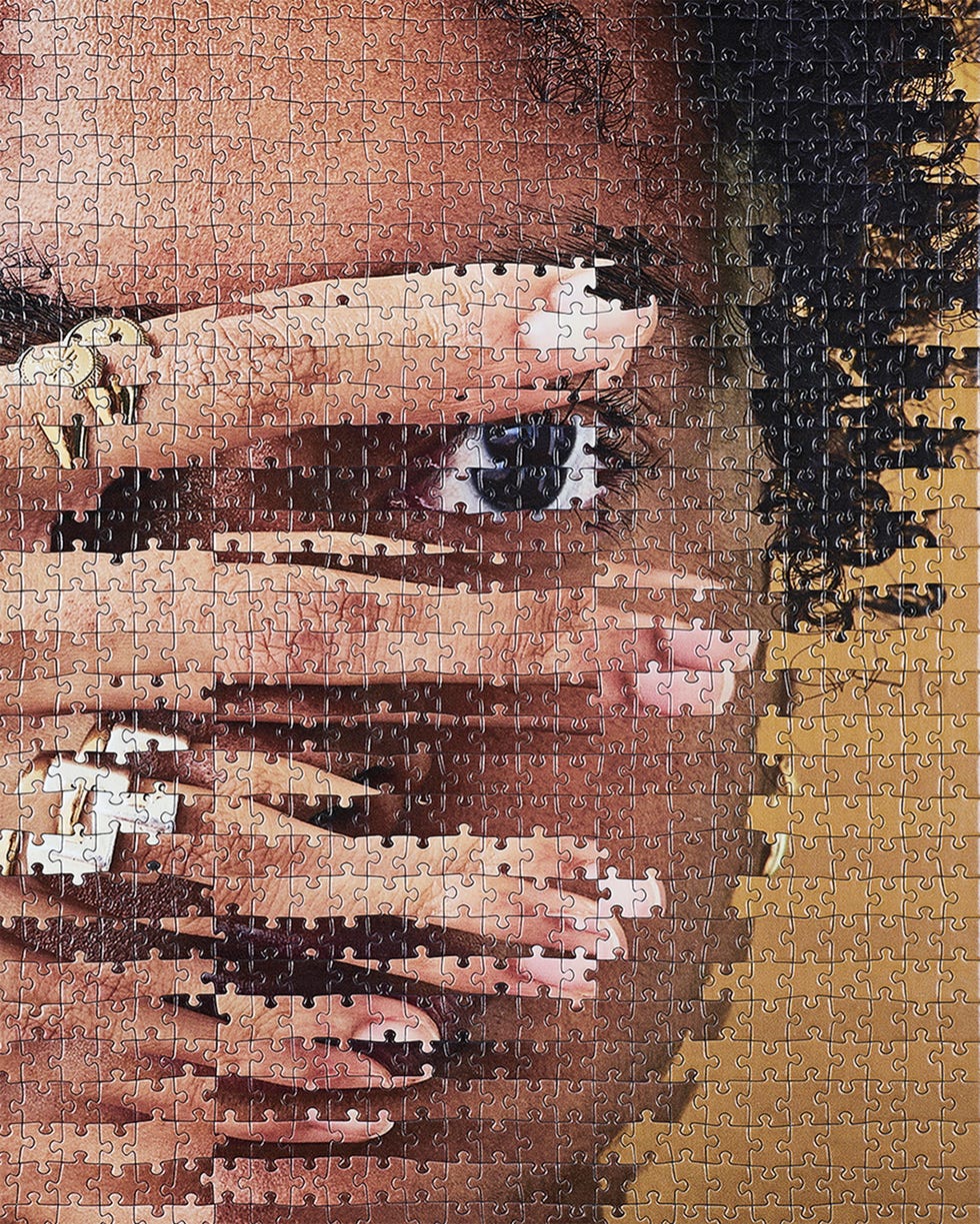 A close-up of a person's eye partially obscured by hands, illustrated as a jigsaw puzzle. A close-up of a person's eye partially obscured by hands, illustrated as a jigsaw puzzle.