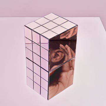 mirror box with woman's ear reflected