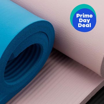 Blue and pink yoga mats with a "Prime Day Deal" label on a textured background.