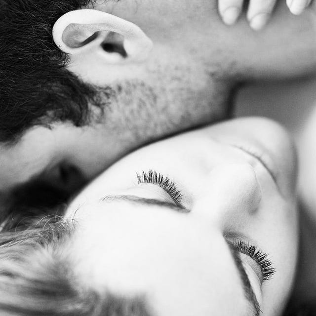 A close-up of a couple embracing, showcasing affection in a soft, black-and-white composition. A close-up of a couple embracing, showcasing affection in a soft, black-and-white composition.