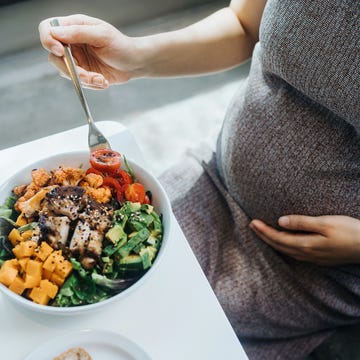 Cropped shot of pregnant woman gently touching her belly, eating fresh and healthy multi-coloured vegetable salad bowl. Eating well with balanced nutrition. Healthy eating habit and lifestyle during pregnancy cropped shot of pregnant woman gently touching her belly, eating fresh and healthy multi coloured vegetable salad bowl. eating well with balanced nutrition. healthy eating habit and lifestyle during pregnancy