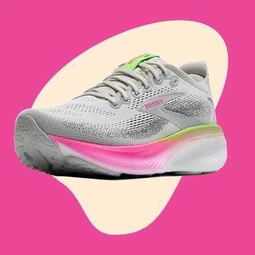 Sport shoes and wireless headphones displayed against a vibrant pink and cream background. Sport shoes and wireless headphones displayed against a vibrant pink and cream background.