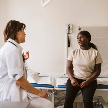 pcos renamed pmos: woman in doctor's appointment