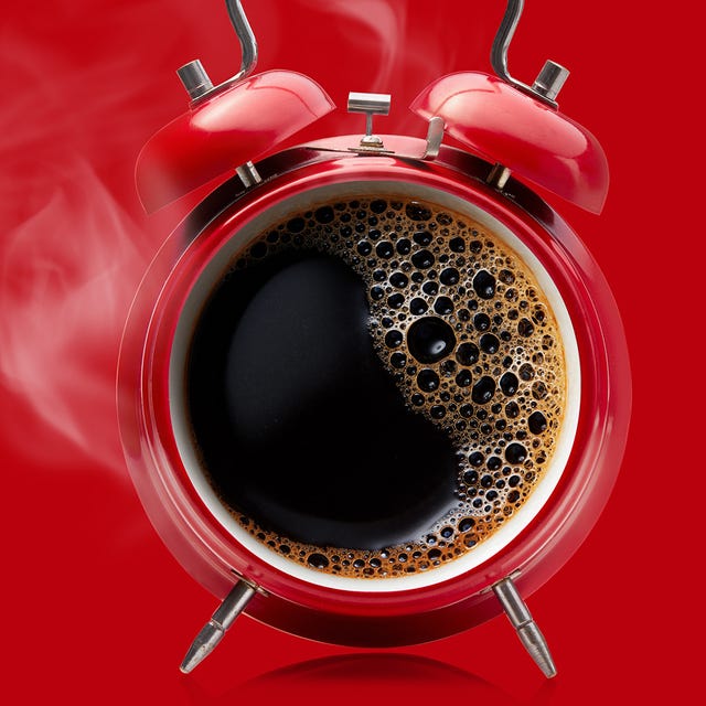 hot coffee in a retro alarm clock wake up alarm coffee concept