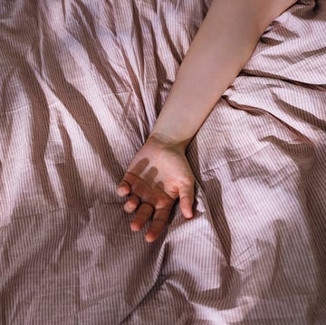 Arm of an Anonymous Woman Sleeping in Bed (From Above) arm of an anonymous woman sleeping in bed from above