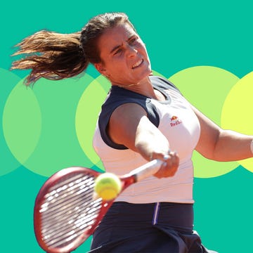 A tennis player striking a forehand shot with a colorful background.