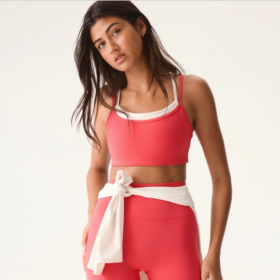 woman wearing red athletic outfit with white accents