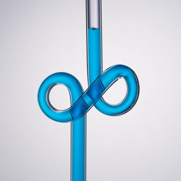 Infinity Symbol Shaped Glass Tube infinity symbol shaped glass tube with blue liquid on white background