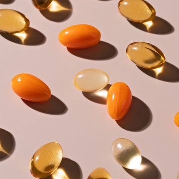 Various colored gel capsules scattered on a soft surface.