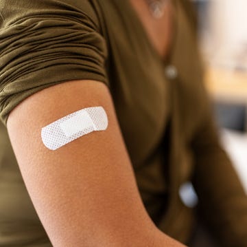 Bandage on arm of a female after taking vaccine bandage on arm of a female after taking vaccine