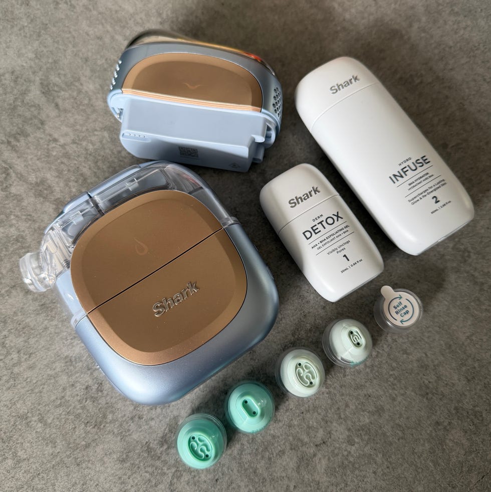 shark cleaning products and accessories on a gray surface. shark facialpro glow review