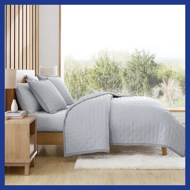 Sound machine and cozy bedroom with a neatly made bed and decorative pillows.