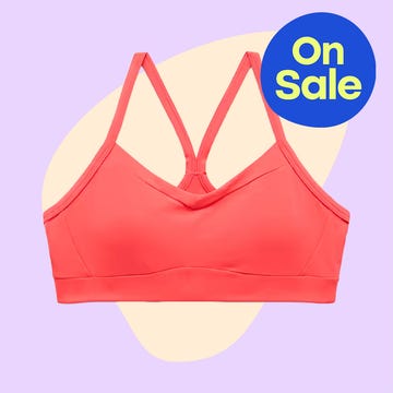 Coral sports bra and olive high-waisted capri pants with a sale banner.