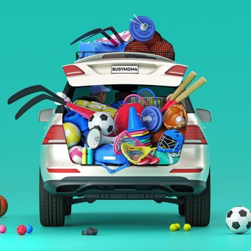 Car trunk filled with various sports equipment and gear. Car trunk filled with various sports equipment and gear.