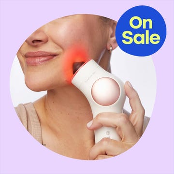 A woman using a light therapy device on her face, with a promotional "On Sale" label in the corner.
