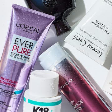 Collection of various hair care products, including shampoos and styling treatments.