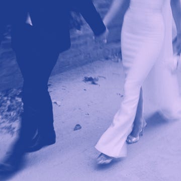 couple walking hand in hand showcasing a wedding theme couple walking hand in hand showcasing a wedding theme