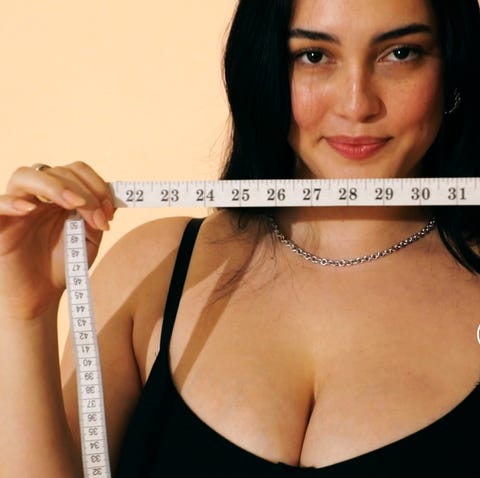 woman holding measuring tape woman holding measuring tape