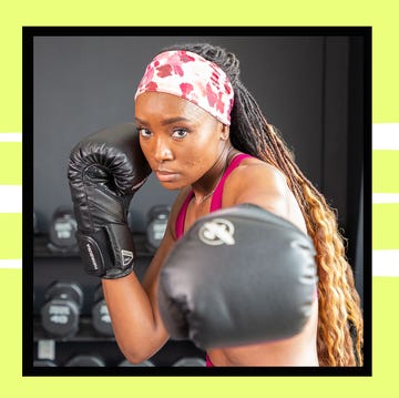 a person preparing to box wearing gloves and a headband a person preparing to box wearing gloves and a headband