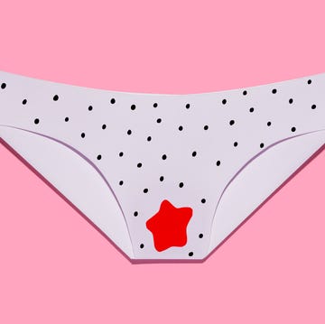 women's panties stained with menstrual blood, free bleeding on pink background