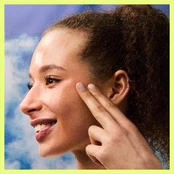 Woman applying sunscreen on her face next to a bottle of Elta MD UV Clear tinted sunscreen SPF 46. Woman applying sunscreen on her face next to a bottle of Elta MD UV Clear tinted sunscreen SPF 46.