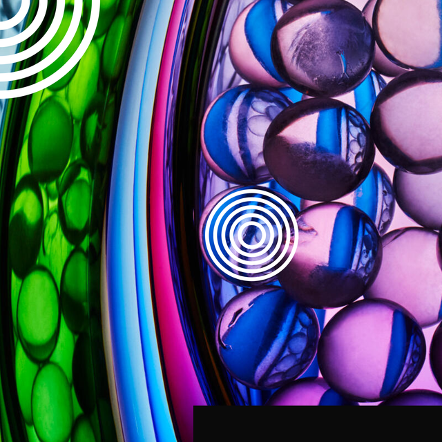 Colorful translucent spheres arranged in layers with circular patterns and a gradient background.
