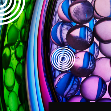 Colorful translucent spheres arranged in layers with circular patterns and a gradient background.